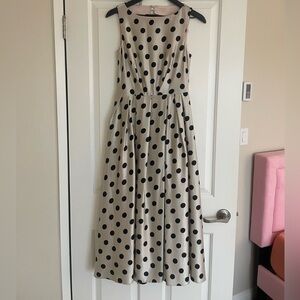 Prom beige dress with black dots and a black belt. The dress has never been worn